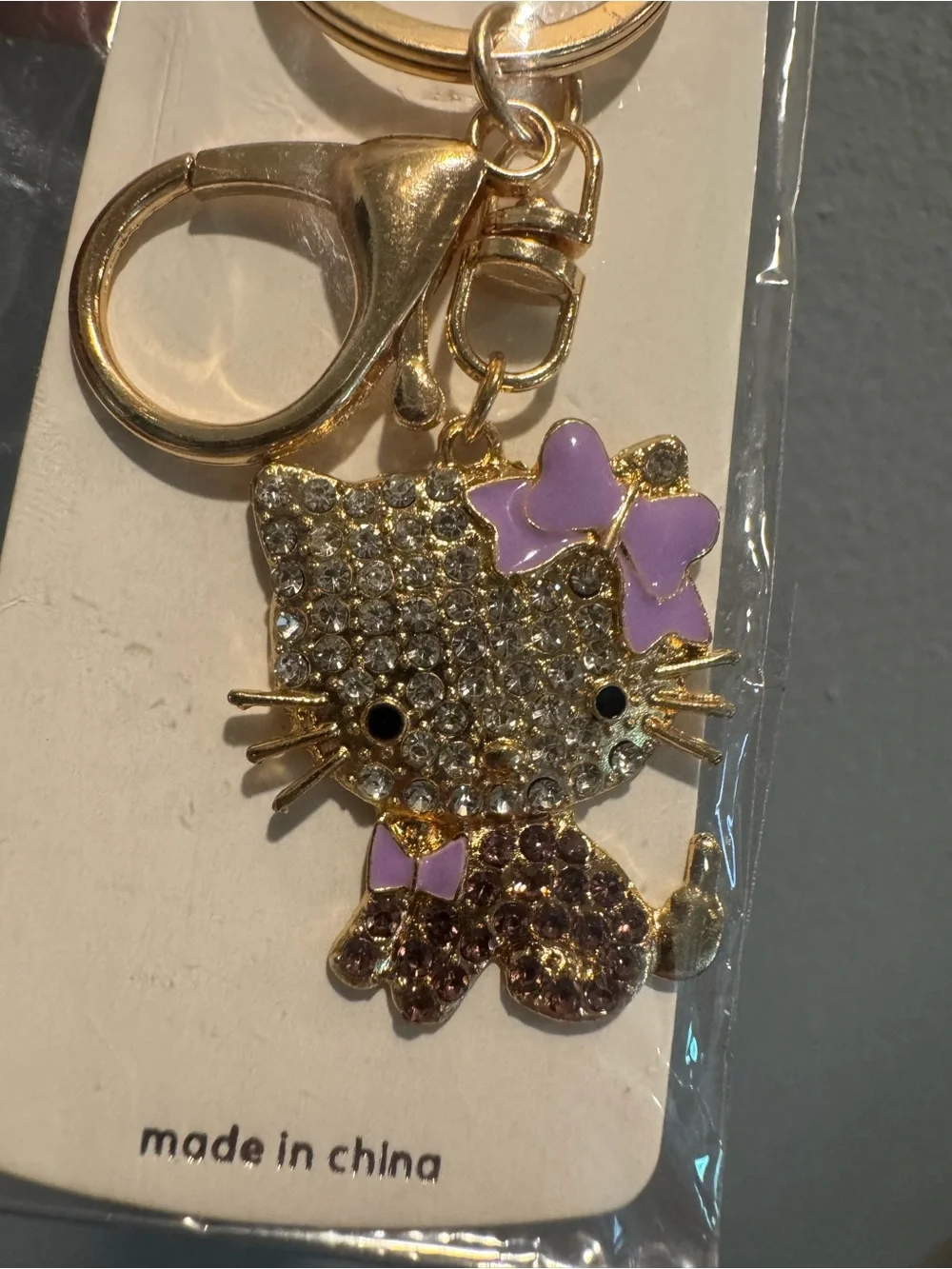 Gold-tone Cat Keychain or Bag Charm with Purple Accents